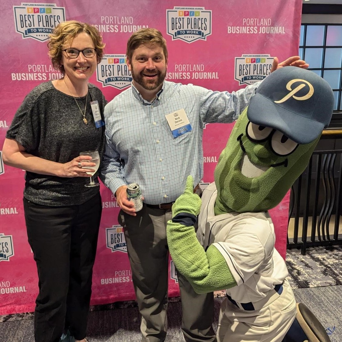 Jennifer Murphy and Nick Deccio with Mr. Pickle at PBJ Best Workplaces event 2024